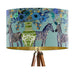 A maximalist design of Zebra's, chinoiserie vases and colourful flowers on a blue green mint backdrop on a large sized 40x25cm handcrafted fabric lampshade by artist Kelly Stevens-McLaughlan