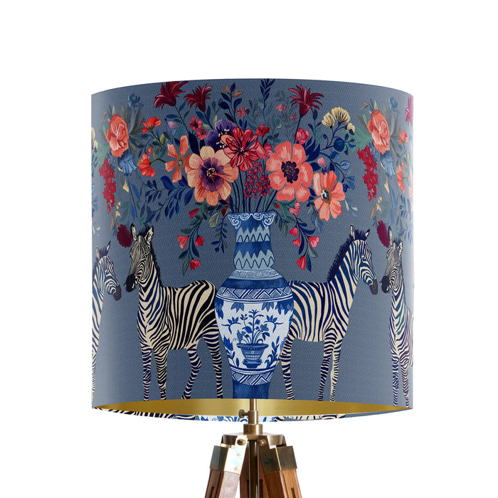 A maximalist design of Zebra's, chinoiserie vases and colourful flowers on a blue backdrop on a small sized 20x18cm handcrafted fabric lampshade by artist Kelly Stevens-McLaughlan