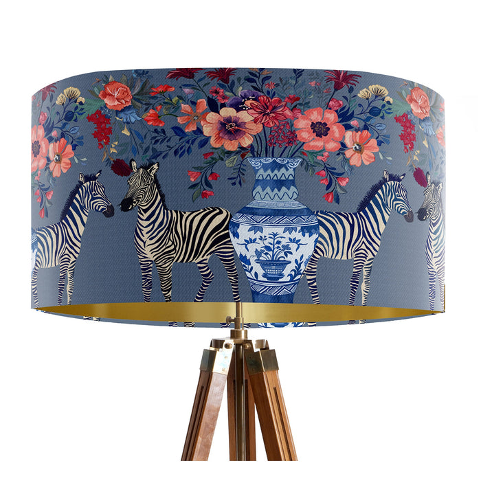 A maximalist design of Zebra's, chinoiserie vases and colourful flowers on a blue backdrop on a Extra large sized 45x25cm handcrafted fabric lampshade by artist Kelly Stevens-McLaughlan