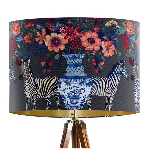 A maximalist design of Zebra's, chinoiserie vases and colourful flowers on a charcoal backdrop on a classic sized 30x21cm handcrafted fabric lampshade by artist Kelly Stevens-McLaughlan