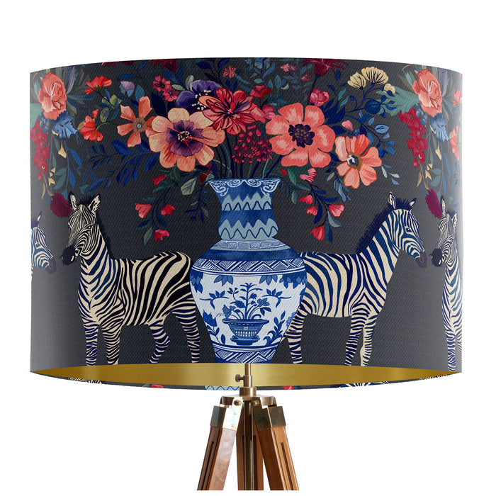 A maximalist design of Zebra's, chinoiserie vases and colourful flowers on a charcoal backdrop on a classic sized 30x21cm handcrafted fabric lampshade by artist Kelly Stevens-McLaughlan