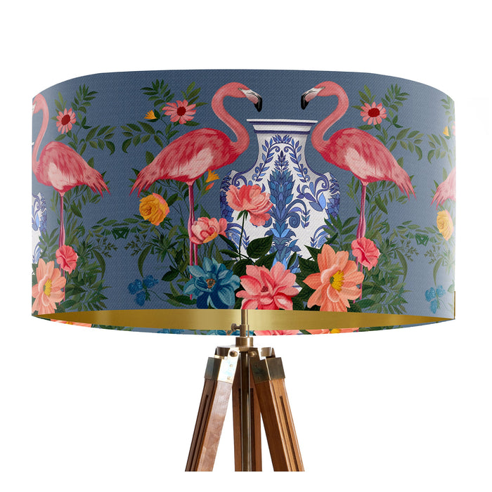 A maximalist design of pink flamingos, chinoiserie vases and colourful flowers on a blue backdrop on a Extra large sized 45x25cm handcrafted fabric lampshade by artist Kelly Stevens-McLaughlan