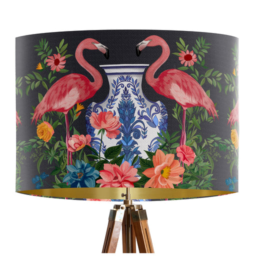 A maximalist design of pink flamingos, chinoiserie vases and colourful flowers on a charcoal backdrop on a classic sized 30x21cm handcrafted fabric lampshade by artist Kelly Stevens-McLaughlan