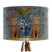 A maximalist design of leopards, chinoiserie vases and colourful flowers on a blue backdrop on a classic sized 30x21cm handcrafted fabric lampshade by artist Kelly Stevens-McLaughlan