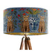 A maximalist design of leopards, chinoiserie vases and colourful flowers on a blue backdrop on a Extra large sized 45x25cm handcrafted fabric lampshade by artist Kelly Stevens-McLaughlan