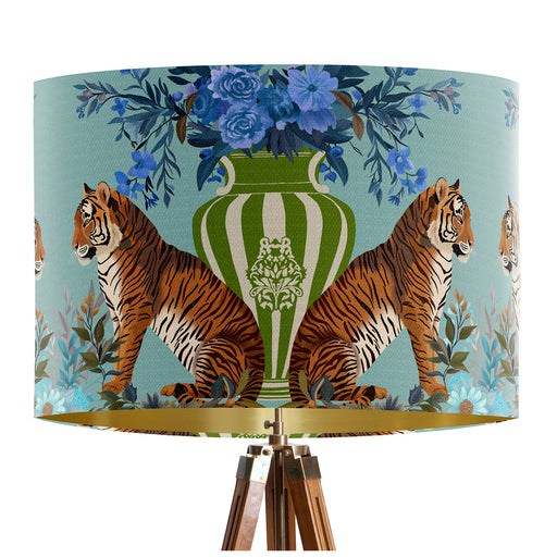 A maximalist design of tigers, chinoiserie vases and colourful flowers on a blue green mint backdrop on a classic sized 30x21cm handcrafted fabric lampshade by artist Kelly Stevens-McLaughlan