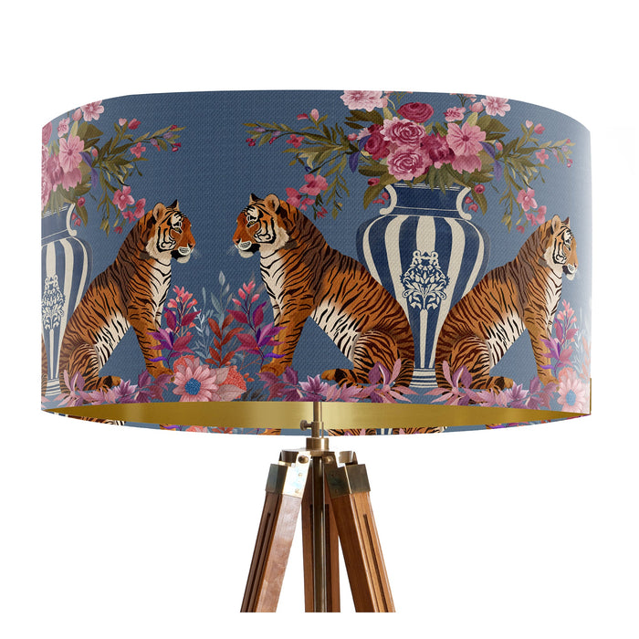 A maximalist design of tigers, chinoiserie vases and colourful flowers on a blue backdrop on a Extra large sized 45x25cm handcrafted fabric lampshade by artist Kelly Stevens-McLaughlan