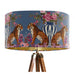 A maximalist design of tigers, chinoiserie vases and colourful flowers on a blue backdrop on a Extra large sized 45x25cm handcrafted fabric lampshade by artist Kelly Stevens-McLaughlan