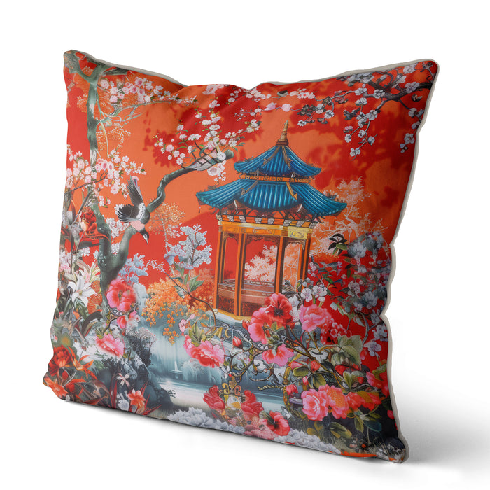 Burnt orange cushion with blue pagoda and floral pattern.