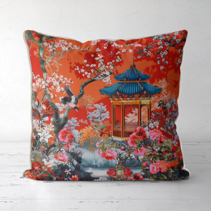 Burnt orange cushion with blue pagoda and floral pattern.