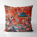 Burnt orange cushion with blue pagoda and floral pattern.