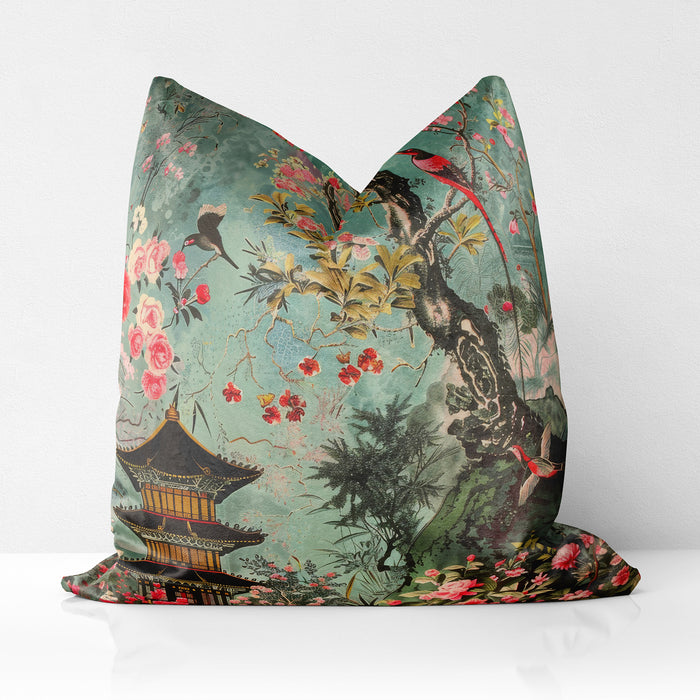 Teal velvet cushion with pagoda and blooming flowers, featuring birds perched on branches