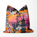 Cushion with a sunset scene, featuring a pagoda and vibrant orange, pink, and red floral details