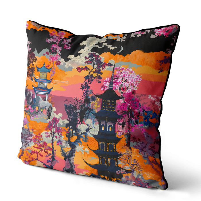 Cushion with a sunset scene, featuring a pagoda and vibrant orange, pink, and red floral details