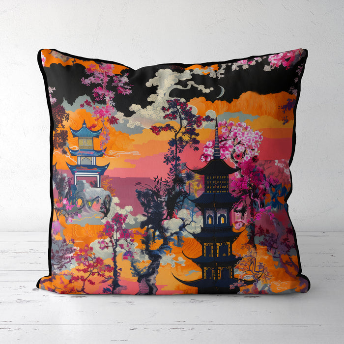 Cushion with a sunset scene, featuring a pagoda and vibrant orange, pink, and red floral details