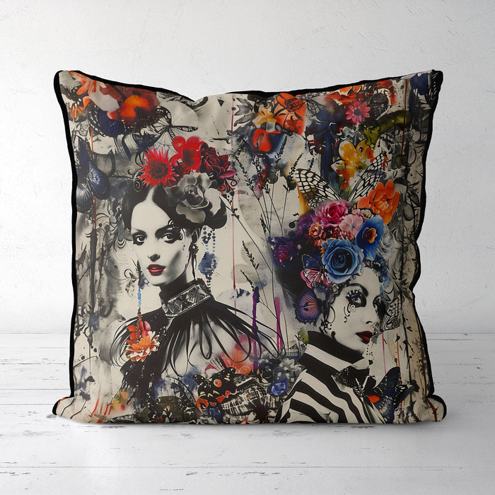 Striking decorative cushion, a fusion of gothic and bohemian styles. Two monochromatic women adorned with elaborate floral headdresses and butterflies splashed in vibrant colours, a dramatic and enchanting visual effect combining gothic elegance with bohemian flair.