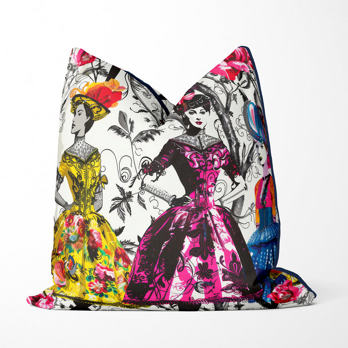 Modern designer cushion, three elegantly dressed women, vibrant colourful dresses and fancy hats against a monochromatic background of delicate botanical illustrations. Intricate floral patterns of vivid yellow, pink, and blue hues stand out in classic elegance with modern colour pops.