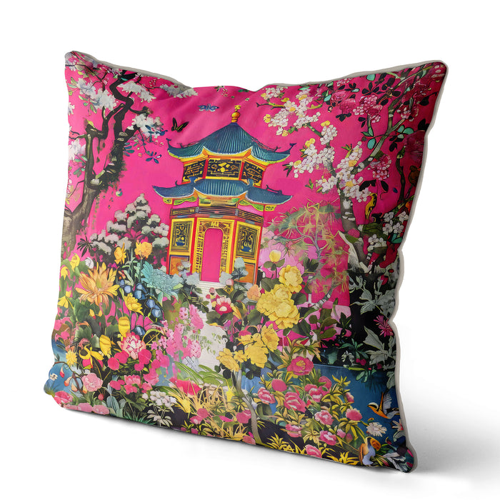 Bright pink cushion with a pagoda and lush floral design.