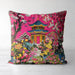 Bright pink cushion with a pagoda and lush floral design.