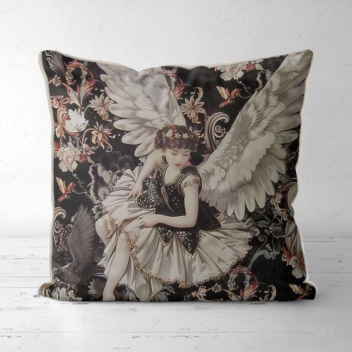 Celestial cushion pillow cover of a sophisticated angel in a pretty dress covered in sequins with huge white feathered wings surrounded by delicate flowers on a black background