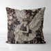 Celestial cushion pillow cover of a sophisticated angel in a pretty dress covered in sequins with huge white feathered wings surrounded by delicate flowers on a black background