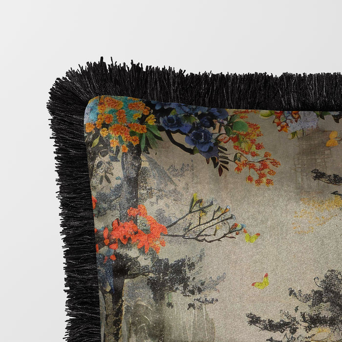 Grey velvet cushion with black fringed edge, featuring a pagoda and floral accents.