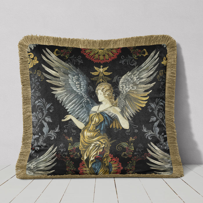 Luxury velvet designer cushion, pillow cover in Baroque style featuring a detailed angel with large wings, set against a dark background with intricate floral and ornamental motifs. The pillow has a gold/beige fringe border.