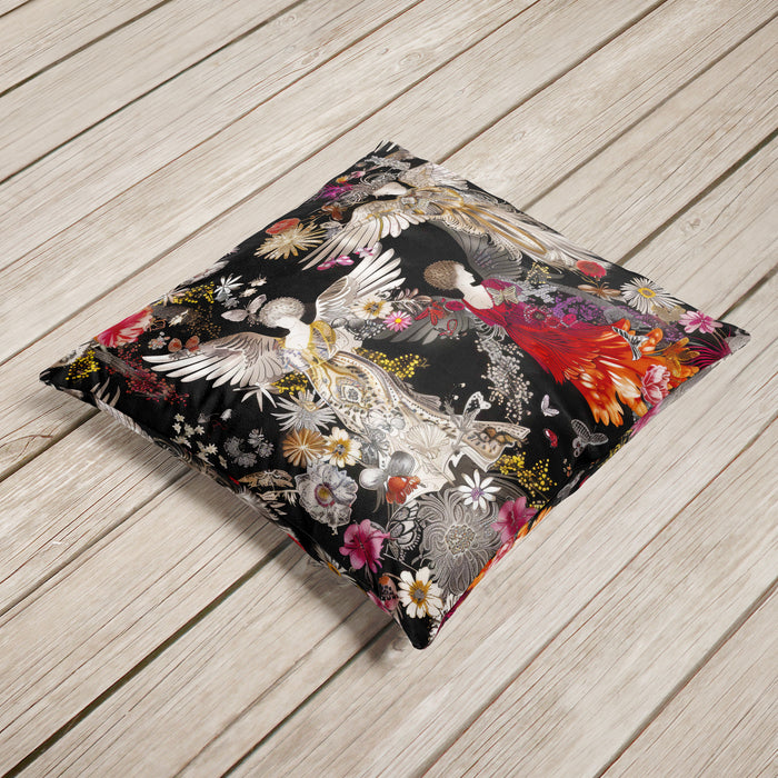 Luxury velvet cushion pillow cover featuring three ethereal figures with wings, adorned in golden, silver, and red flowing gowns, set against a dark background with floral and intricate patterns.