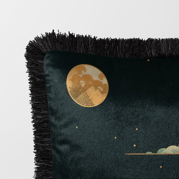 Dark velvet cushion featuring a pagoda illuminated by a golden moon and surrounded by florals with a fringed edge.