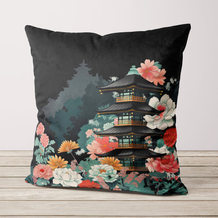 Velvet cushion featuring a pagoda surrounded by florals on a black background.