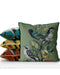 Handmade cushion/pillow cover illustration of a flock of birds perched on branches on a green background