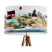 A vibrant whimsical Scandinavian coastal village design on a large sized 40x25cm handcrafted fabric lampshade by artist Kelly Stevens-McLaughlan