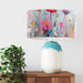 Delicate colourful wildflower design against a serene pale blue backdrop on a Extra large sized 45x25cm handcrafted fabric lampshade by artist Kelly Stevens-McLaughlan