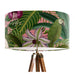 Parrots in white, green & blue along with monkeys sit amoungst green tropical leaves on a pink background on a Extra large sized 45x25cm handcrafted fabric lampshade by artist Kelly Stevens-McLaughlan