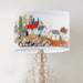 A vibrant whimsical Scandinavian coastal village design on a classic sized 30x21cm handcrafted fabric lampshade by artist Kelly Stevens-McLaughlan