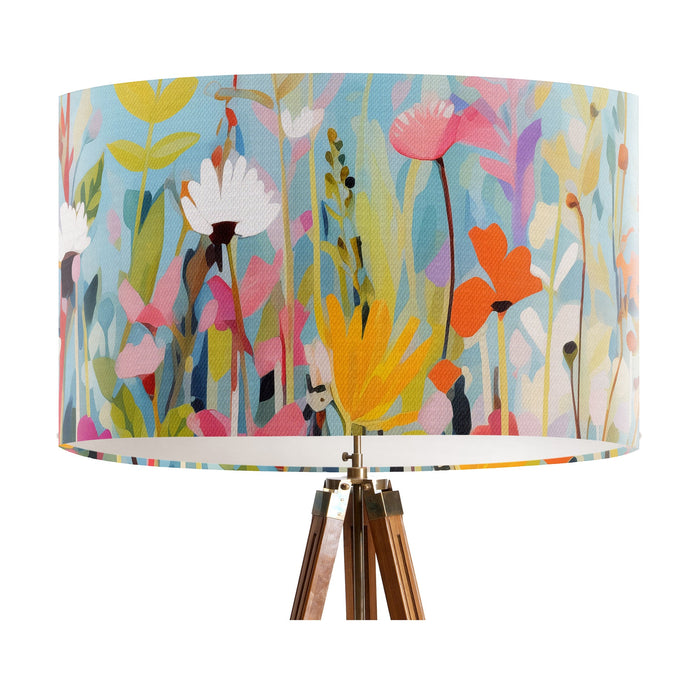 Vinrentia colourful wildflower design against a sky blue backdrop on a large sized 40x25cm handcrafted fabric lampshade by artist Kelly Stevens-McLaughlan