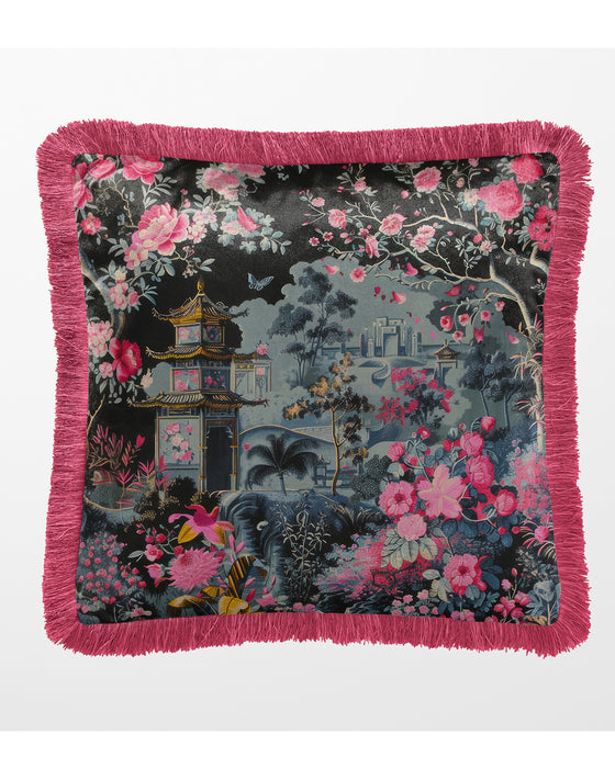 Black velvet cushion with pink fringe and a pagoda surrounded by pink and magenta flowers