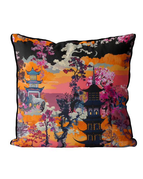 Cushion with a sunset scene, featuring a pagoda and vibrant orange, pink, and red floral details