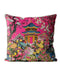 Bright pink cushion with a pagoda and lush floral design.