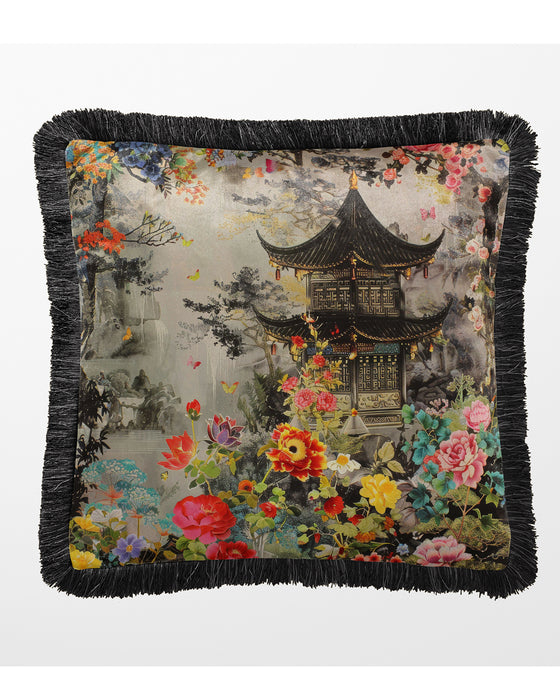 Grey velvet cushion with black fringed edge, featuring a pagoda and floral accents.