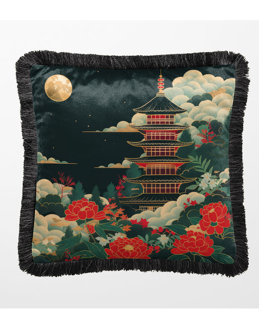 Dark velvet cushion featuring a pagoda illuminated by a golden moon and surrounded by florals with a fringed edge.